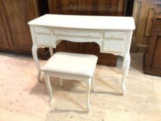 A Laura Ashley dressing table, the moulded serpentine front top over an arrangement of drawers, on