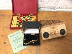 A mixed lot including an Accurist ladies wrist watch, strap a/f, a travelling chess set and a