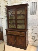 An Edwardian walnut secretaire bookcase, the projecting cornice over astragal bevel glazed doors