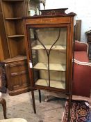 An Edwardian mahogany display cabinet, the raised back and frieze with painted and inlaid floral