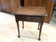 An early 19thc oak side table top with moulded edges over single drawer, turned supports,