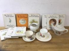 A mixed lot including a collection of Beatrix Potter books, also a 1930's child's teapot with