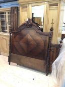 A late 19thc French (?) rosewood 4ft6 standard double bed frame, the headboard with cartouche,