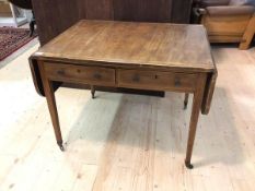 An early 19thc inlaid mahogany sofa table with two drawers opposite two faux drawers, raised on