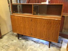 A Gimpson & Slater Ltd, a mid century teak side cabinet, the super structure with twin sliding glass