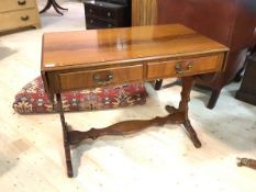 A reproduction Georgian style mahogany sofa table, the cross banded top with two shaped drop