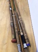 A group of fishing rods including one with brass cap to base which is inscribed D Watson & Co,