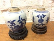 Two Chinese Ginger jars both lacking lid, measure 12cm high, with pierced circular stands (4)