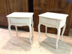 A pair of Laura Ashley bedside tables with moulded serpentine front tops over single drawers on