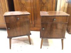 A pair of 40's / 50's Remploy mahogany bedside tables each with drawer over cupboard on splayed