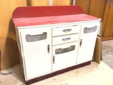 A 1950's / 60's kitchen counter base unit, the ledgeback over a veined red vinyl top, over