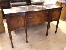 A Bevan Funnel Reprodux reproduction Georgian style serpentine sideboard, label to interior, with