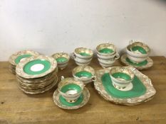 A 1930's/40's Paragon tea set in green and gold design including ten teacups which measure 6cm high,