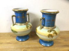 A pair of Noritake European style baluster shaped vases with handles to sides, measures 27cm high