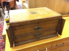 An Edwardian oak canteen, the top with inlaid metal star of Masonic interest, the hinged top has