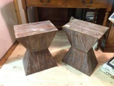A pair of geometric designed wooden stools or plinths each measures 48cm x 38cm x 26cm