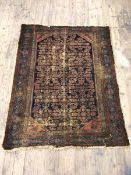 A Hamadan rug the field with multiple stylised flower heads and spandrels to corners, areas of