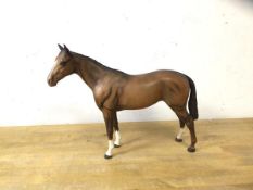 A Beswick china horse with slight chip to back left knee, measures 20cm high