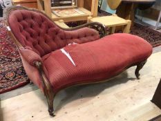 A mid Victorian mahogany framed chaise longue, the floral carved and pierced crest rail above