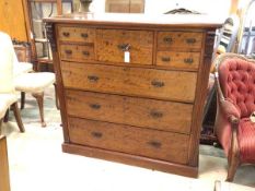 An Edwardian mahogany chest fitted with five short and three long drawers, flanked by fluted