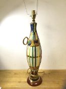 An Italian ceramic table lamp in the form of an elongated bottle with polychrome decoration,