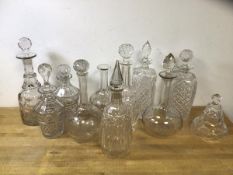 A group of decanters of various ages, sizes and designs, tallest measures 25cm high