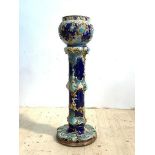 A Victorian majolica jardiniere on stand, the blue ground with stylised floral design, H90cm