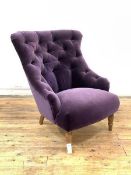A Victorian style button back bedroom chair, upholstered in purple velvet fabric, raised on turned