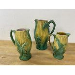 A group of three Majolica jugs, all in the form of corn on the cob, largest measures 24cm high