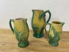 A group of three Majolica jugs, all in the form of corn on the cob, largest measures 24cm high