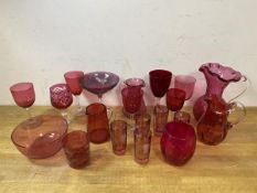 A collection of Edwardian cranberry glass including water jugs, tallest measures 18cm high, sherry