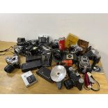 A large collection of photographic equipment including those by Kodak, Ross Enson, a Nettar Petri