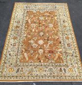 A Large flat weave ground rug, possibly Indian, the orange field of interlaced and trailing