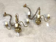 A pair of Dutch style brass three branch chandeliers, with scrolled arms and faux candles, H31cm,