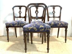 A Set of four Victorian mahogany dining chairs, floral carved crest rail and pierced splat over