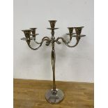 A four branch candelabra with four arms radiating from centre on a waisted body raised on circular
