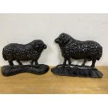 Two 19thc cast iron door stops in the form of sheep, largest measures 19cm high