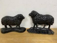 Two 19thc cast iron door stops in the form of sheep, largest measures 19cm high