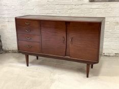 A Scottish mid century mahogany sideboard, fitted with four graduated drawers and two panelled