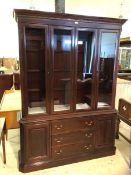 A Georgian style mahogany two-part bookcase cornice with dentil moulding over three sections, one