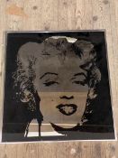 A reverse silhouette decorative wall mirror depicting Marilyn Monroe, measures 68cm x 63cm