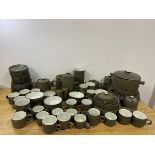 A large quantity of Denby china including eight dinner plates measuring 25cm diameter, coffee