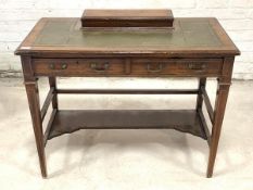 An Edwardian rosewood writing desk, the top with hinged stationary compartment over inset tooled