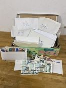 A mixed lot including a collection of international stamps, all in envelopes with country's names,