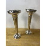 A pair of 1920's / 30's weighted Birmingham silver bud vases each measures 18cm high, combined