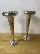 A pair of 1920's / 30's weighted Birmingham silver bud vases each measures 18cm high, combined
