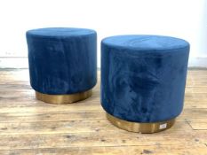 A Pair of contemporary cylindrical stools, upholstered in blue crushed velvet, raised on a brass