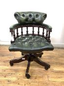 A Reproduction captains style swivel desk chair, the back and arms, on a spindle gallery, and seat