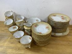 An AOPC teaset including twelve teacups, each measuring 6cm high, twelve saucers, twelve side