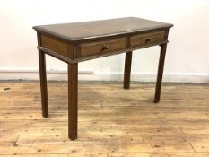 An Early 20th century oak comunion side table, the rectangular moulded top over frieze with two